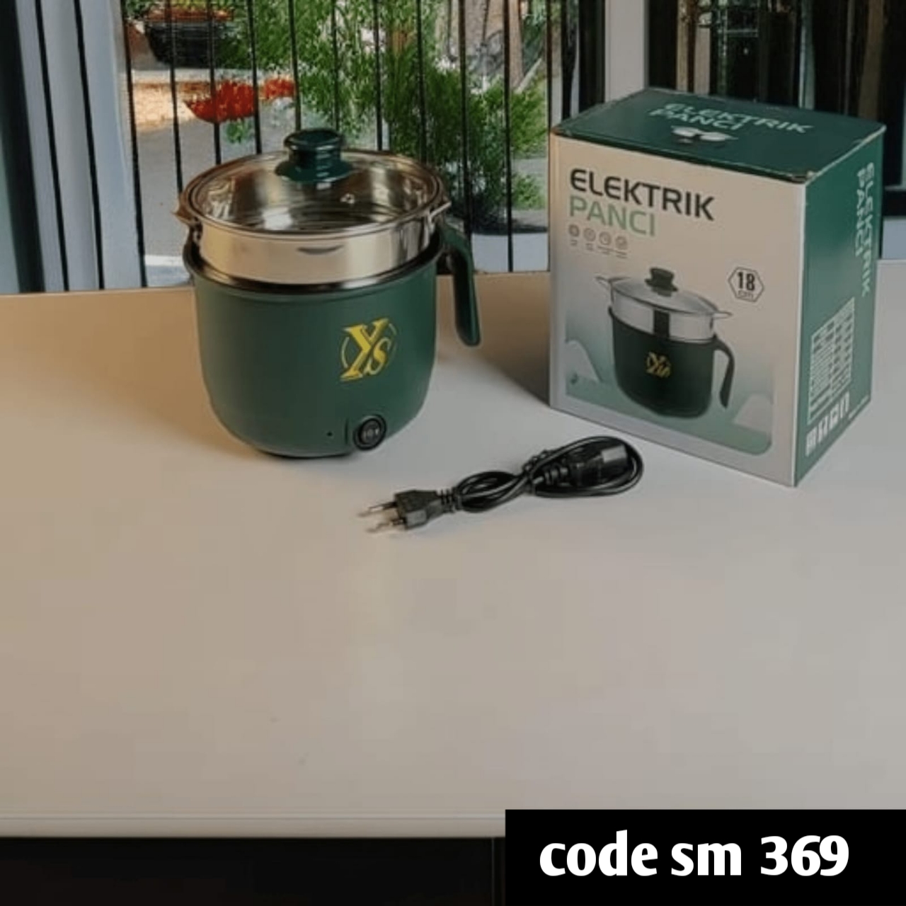 Elektrik Panci,” which is an electric multi-cooker with a capacity of 1.8 liters. It can be used for cooking rice, hot pot, and other meals.